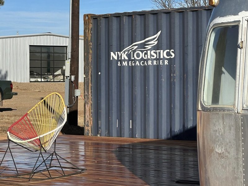 Airstream trailer with deck on the property