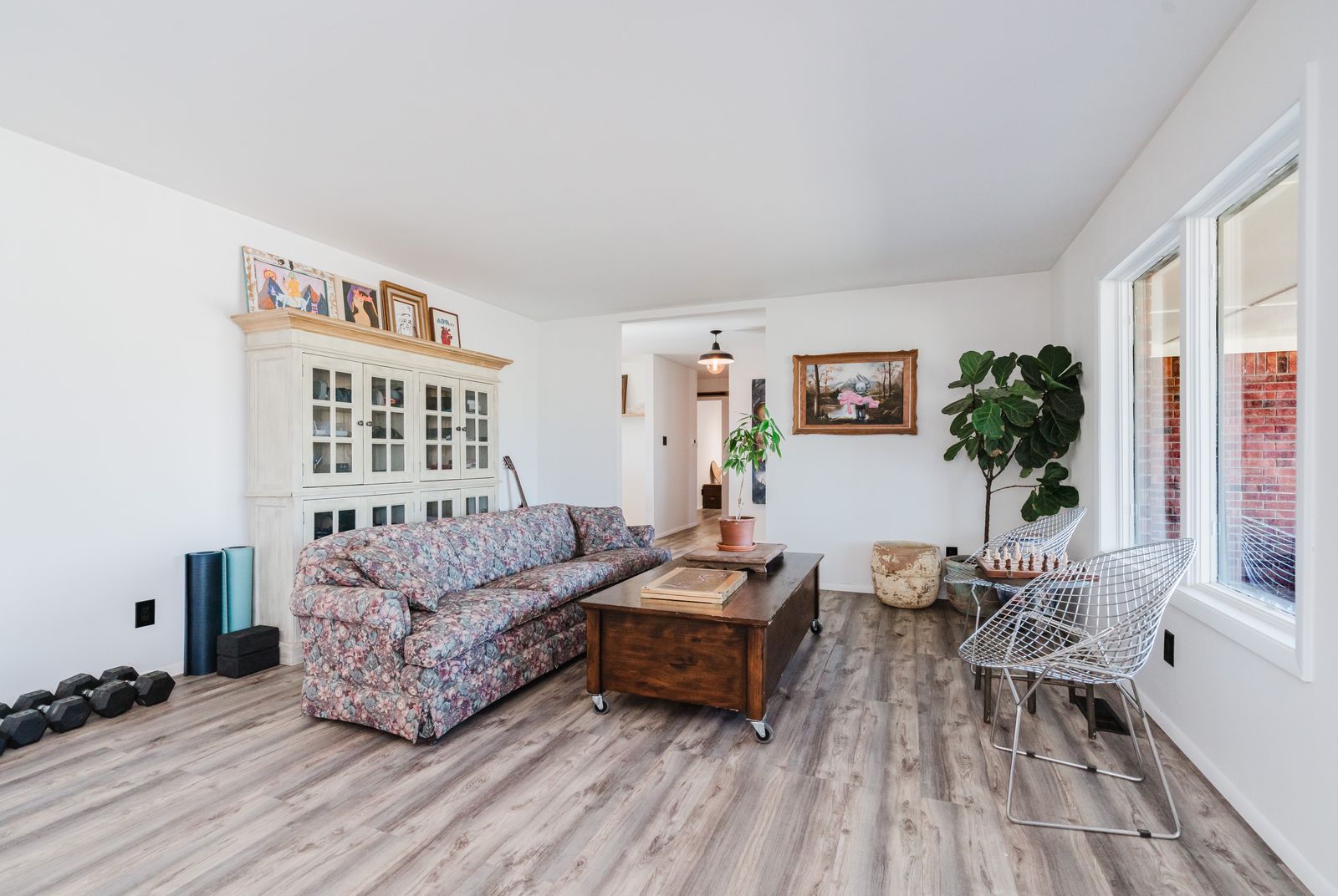 Living room with full-wall bookshelves and vintage seating