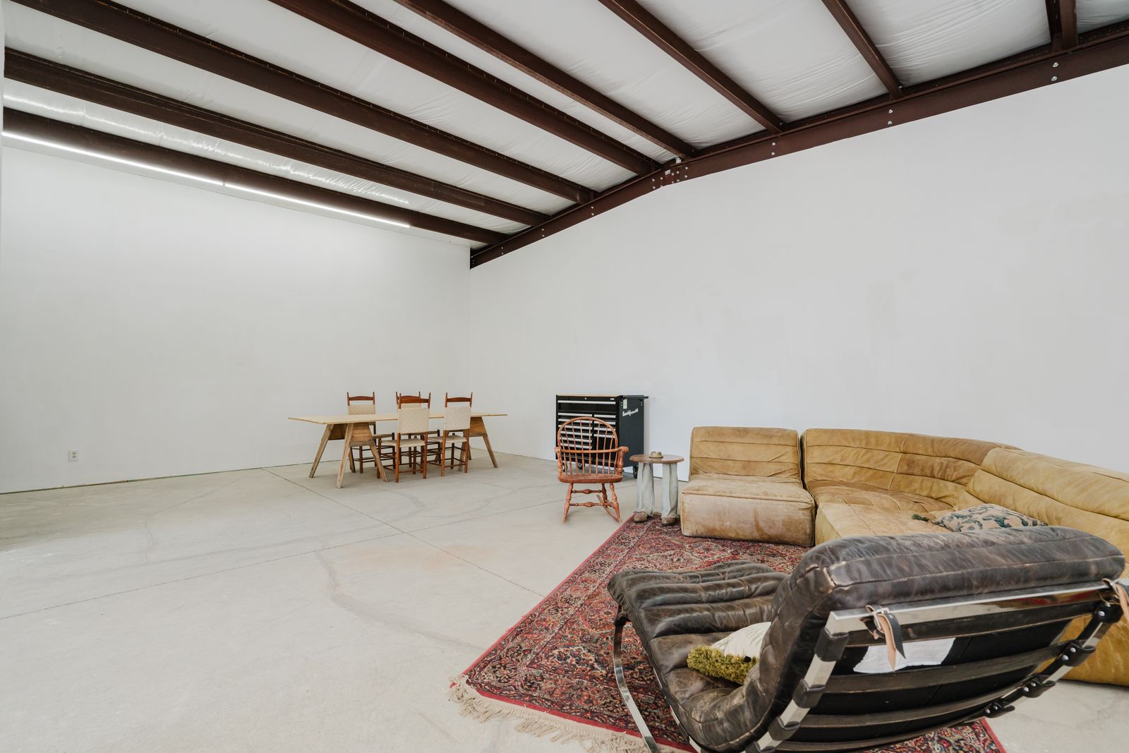 Studio interior with work table and lounge seating