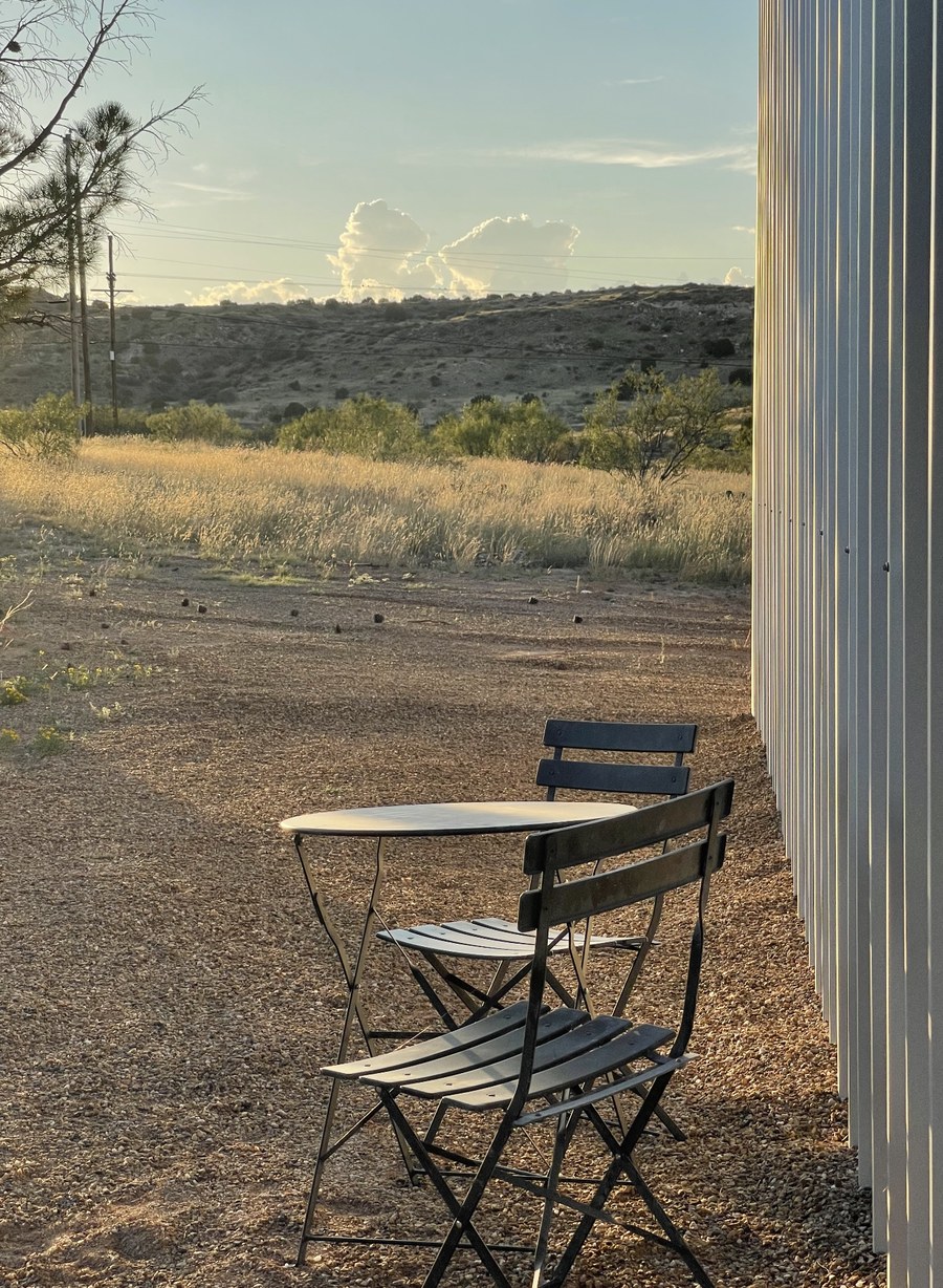 Bistro table outside the studio overlooking desert