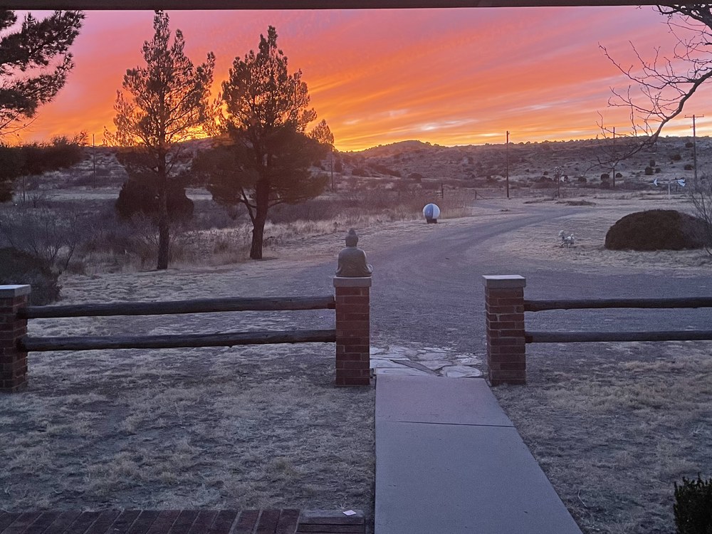 Fiery sunrise over the ranch driveway